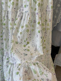 Kleid aus Baumwolle mit Blumenmuster und Stufenrock