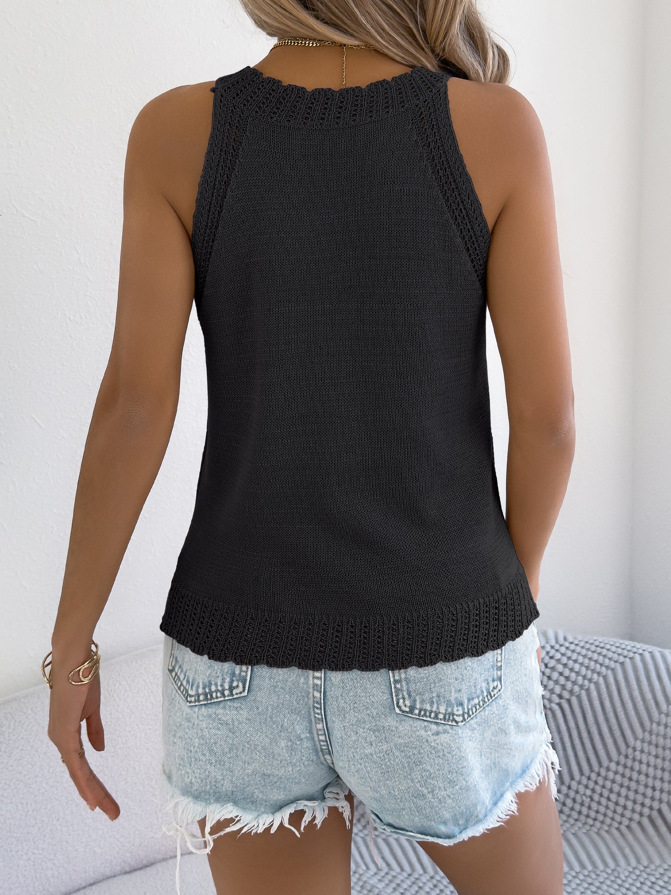 Haut en tricot sans manches ajouré de couleur unie pour femme