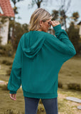 Sweat-shirt ample à capuche et manches longues avec poche de couleur unie